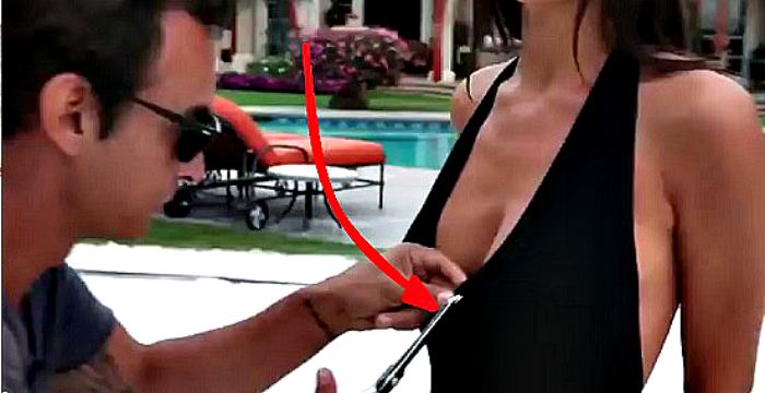 Man redesigns a bathing suit off of the model by cutting her up!