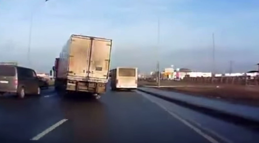 Truck avoids crash on slippery road in daredevil maneuver (VIDEO)