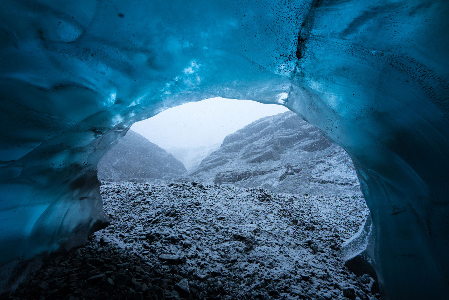 EMBARGOED FOR USE ONLINE AND PRINT UNTIL 00:01 26/11/15Inside the 'ABC cave' - which stands for Amazing Blue Cave. This view shows a snow storm outside the entrance to the cave Photographer explores Vatnaj&ouml;kull glacie using Sony's back-illuminated full-frame sensor, Iceland - 25 Nov 2015 *Full story: http://www.rexfeatures.com/nanolink/rm22 Photographer Mikael Buck with assistance from renowned local Icelandic guide Einar Runar Sigurdsson, explored the frozen world of Vatnaj&ouml;kull glacier in Iceland using Sony's world first back-illuminated full-frame sensor, which features in the 7R II camera. His images were taken without use of a tripod or any image stitching techniques in photoshop. This was made possible through Sony's new sensor technology, allowing incredibly detailed low-light hand held photography. Previously images this detailed would have required carrying bulky equipment to the caves, some of which can require hiking and climbing over a glacier for up to two hours to to access. The images were taken without the use of any external sources - just the natural light that filters through the ice caves.  (Rex Features via AP Images)