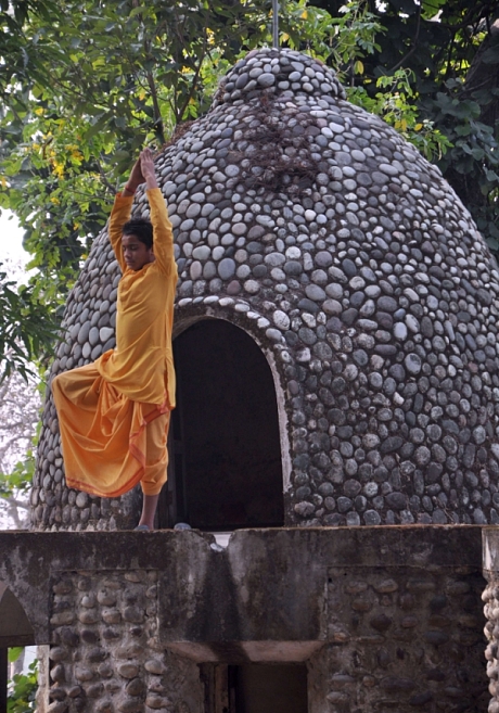 In this photograph taken on December 8, 2015, an Indian devotee practices yoga at the Beatles ashram, as the former ashram of the self-styled guru Maharishi Mahesh Yogi is known, in Rishikesh. An abandoned spiritual retreat in northern India where The Beatles famously learned to meditate has been opened to the public, with plans to turn it into a touristy yoga centre, on December 8, 2015.  AFP PHOTOSTR/AFP/Getty Images