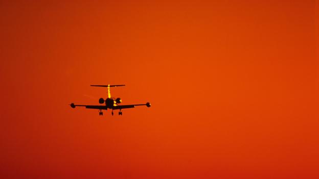 AAX1JH Corporate business jet, Learjet, landing during sunset at the Phoenix international airport Phoenix, Arizona USA.