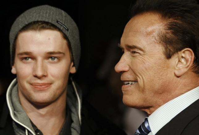 Actor and former California governor Arnold Schwarzenegger (R) poses with his son Patrick as they arrive for the British premiere of 