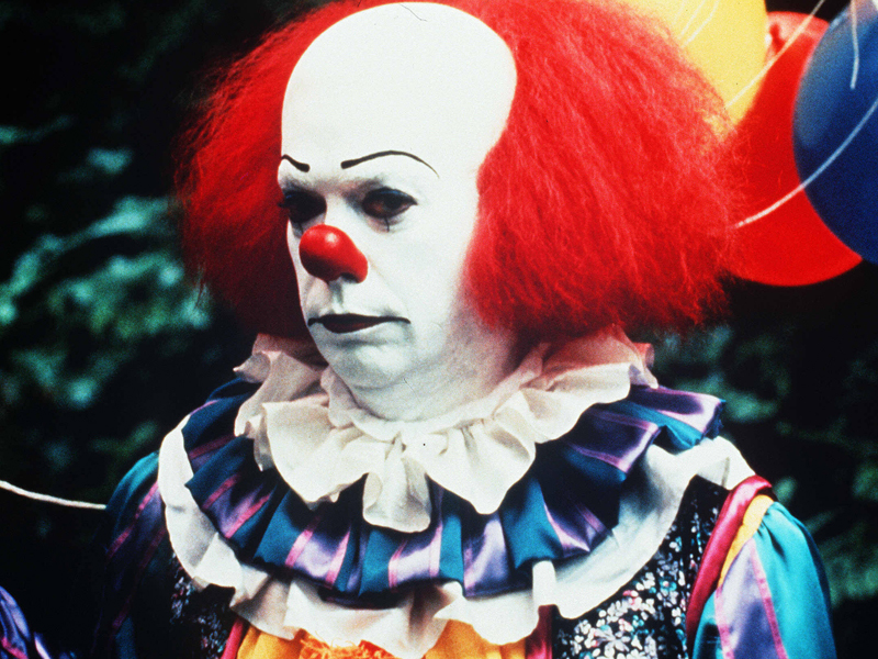 Tim Curry as Pennywise in a 1990 TV adaptation of Stephen King's It. Come on, tell us you aren't just a little creeped out.