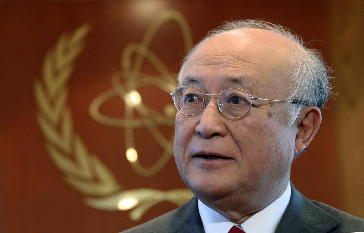 FILE - In this May 12, 2015 file photo, U.N. nuclear chief  Yukiya Amano from Japan speaks during an interview with The Associated Press in Vienna, Austria. Iran's state TV is reporting Amano has arrived in Tehran Saturday, Sept. 20, 2015, to 