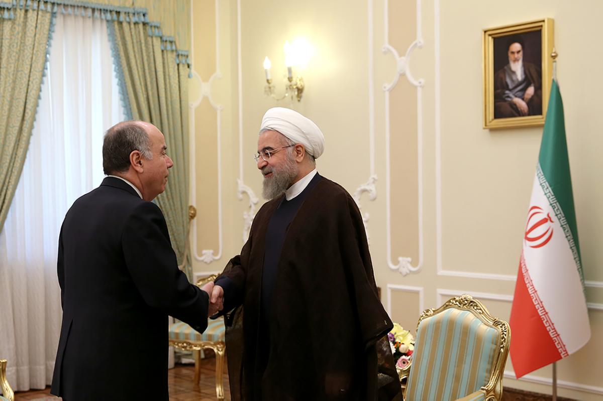 In this photo released by the official website of the office of the Iranian Presidency on Sunday, Sept. 13, 2015, Iran's President Hassan Rouhani, right, greets Brazilian Foreign Minister Mauro Luiz Iecker Vieira at the start of their meeting in Tehran, Iran. (Iranian Presidency Office via AP)