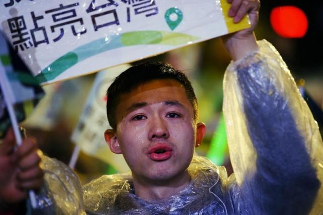 A tear runs down the cheek of a supporter of Taiwan's Democratic Progressive Party (DPP) before the chairperson and presidential candidate Tsai Ing-wen to takes the stage during a final campaign rally ahead of the elections in Taipei, January 15, 2016. REUTERS/Damir Sagolj