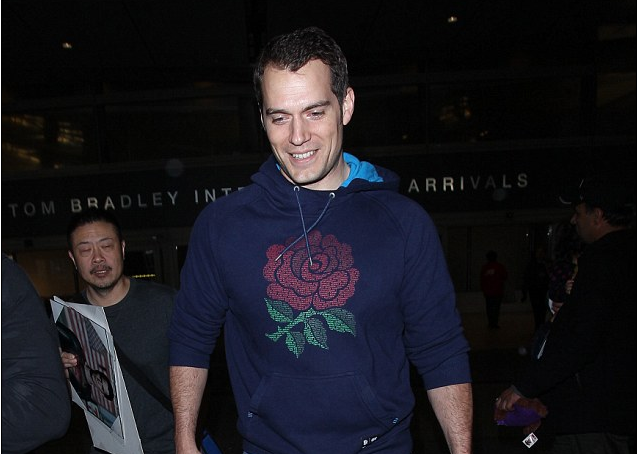 He looks like a super happy man! Hunky Henry Cavill, 32, can’t hide his smile as he jets into LA with stunning girlfriend Tara King, 19, ahead of the Oscars