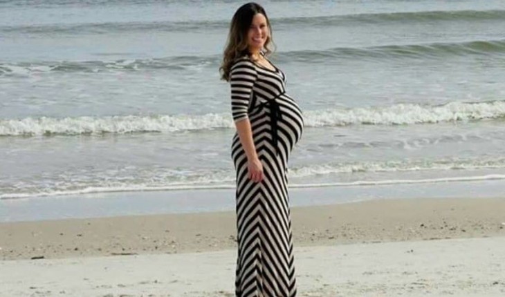 Pregnant Woman Upstaged By Dolphin Photobomb