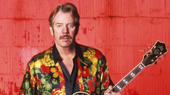 Wife says singer and band leader Dan Hicks dies at age 74