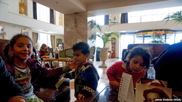 Greek Hoteliers Offer Respite to Weary Migrants