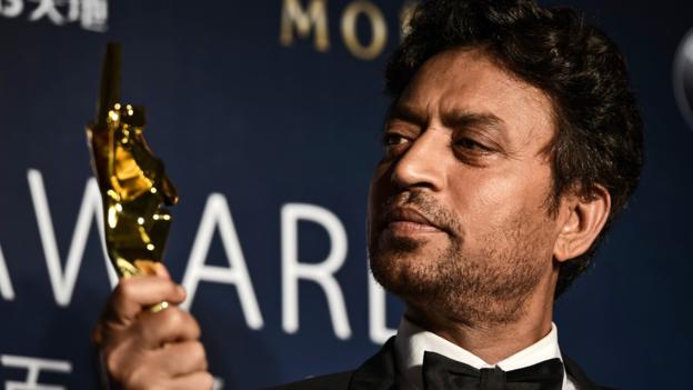 Best actor winner Irrfan Khan of India poses with his trophy during the Asian Film Awards in Macau on March 27, 2014. Movie stars attended the event held annually since 2007, aimed at showcasing the region's movie talent. AFP PHOTO / Philippe Lopez        (Photo credit should read PHILIPPE LOPEZ/AFP/Getty Images)