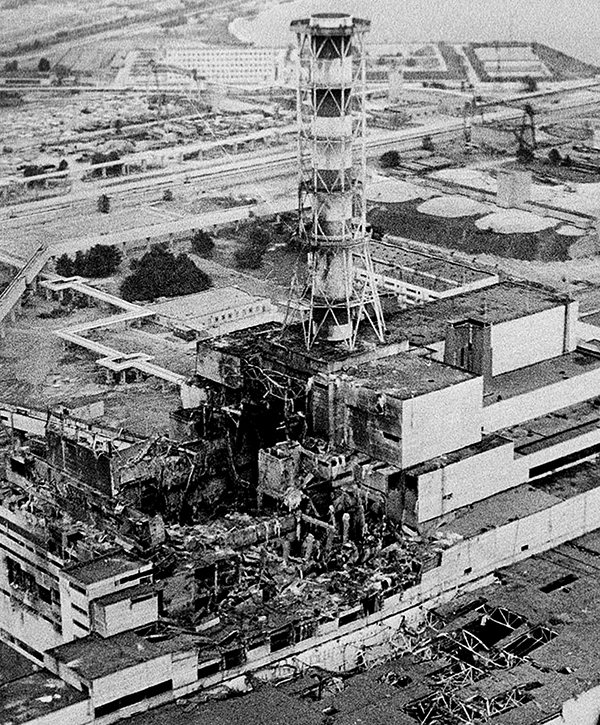An aerial view of the Chernobyl nucler power plant, the site of the world's worst nuclear accident, is seen in April 1986, made two to three days after the explosion in Chernobyl, Ukraine.  In front of the chimney is the destroyed 4th reactor.   (AP Photo)