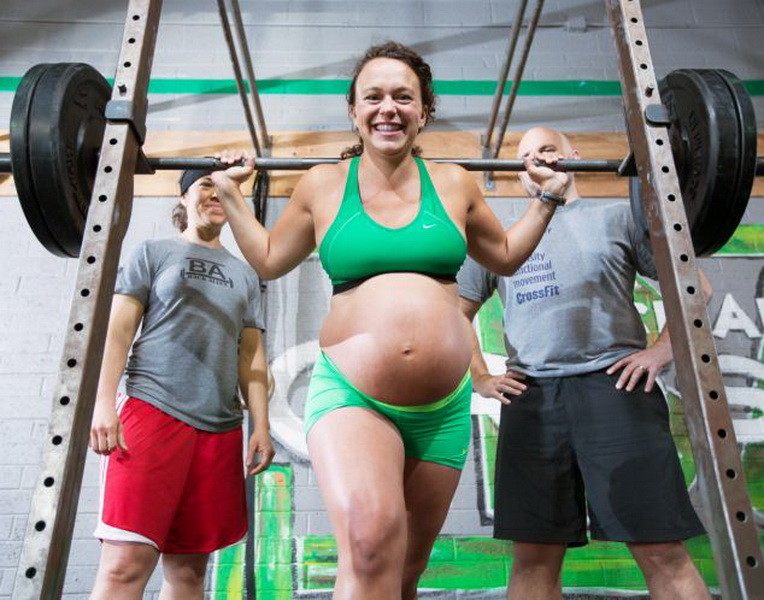 *** STRICT ONLINE EMBARGO UNTIL 00:01 MONDAY 12/05 ***  ***EXCLUSIVE***  PHOENIX, ARIZONA - APRIL 26: Meghan Umphres Leatherman, 33, nine months pregnant and dilated to 1cm seen lifting a heavy weight at her home town gym with her husband Chad and coach Melissa in the background on April 26, 2014 in Phoenix, Arizona.  SUPERFIT Meghan Umphres Leatherman shows she can still lift 215lb weights  despite being nine months pregnant. The mum-to-be was just TWO days away from her due date and 1cm dilated, but that didnt stop her grueling CrossFit fitness regime  which combines weightlifting, gymnastics and cardio activities. The 33-year-old even lifted weights on the day she went into labour and broke records in the final days of pregnancy. As well as going to the gym FOUR times a week, Meghan, from Arizona, America, continued to walk her dog for three miles a day and go on a four-mile hike through the mountains every week. But far from doing herself or her first baby damage, Meghan, a marketing and communications consultant, insists theyre both healthier for it and her pregnancy was actually EASIER. Now she is settling in to life as a mum after giving birth to 6 lb, 11 oz daughter, Florence Germaine, on May 3. But she expects to be back at the gym again in just THREE weeks.  PHOTOGRAPH BY Dave Cruz / Barcroft Media  UK Office, London. T +44 845 370 2233 W www.barcroftmedia.com  USA Office, New York City. T +1 212 796 2458 W www.barcroftusa.com  Indian Office, Delhi. T +91 11 4053 2429 W www.barcroftindia.com