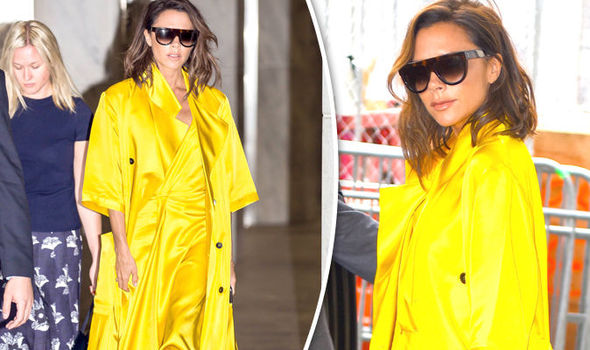 Is that you Victoria Beckham? Designer turns heads in bold yellow dress and trench