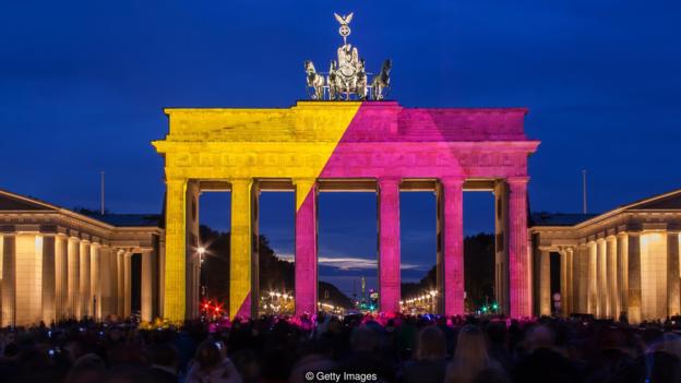Berlin, Brandenburg Gate in special illumination. Public light event in the german capital.