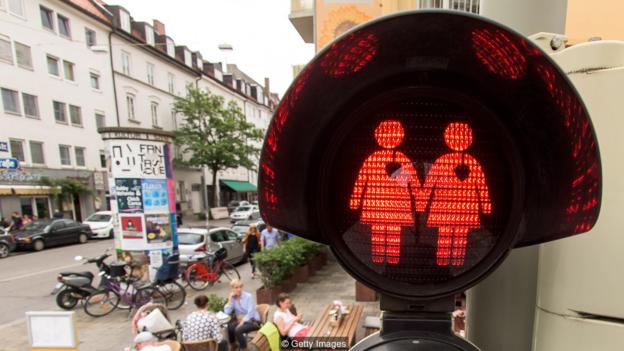MUNICH, GERMANY - JULY 14:  A pedestrian crossing signal showing a female homosexual couple at a junction on July 14, 2015 in Munich, Germany. The city, taking a cue from a similar project in the Austrian city of Vienna, introduced the new signals at a limited number of traffic lights in the city center for the recent CSD gay pride march and has since decided to keep them. The figures glow in red and green at pedestrian crosswalks and show both female and male couples. Other cities in Germany, including Berlin and Hamburg, are also seizing on the initiative. Europe has seen a surge in gay rights awareness since the May gay marriage referendum in Ireland.  (Photo by Joerg Koch/Getty Images)