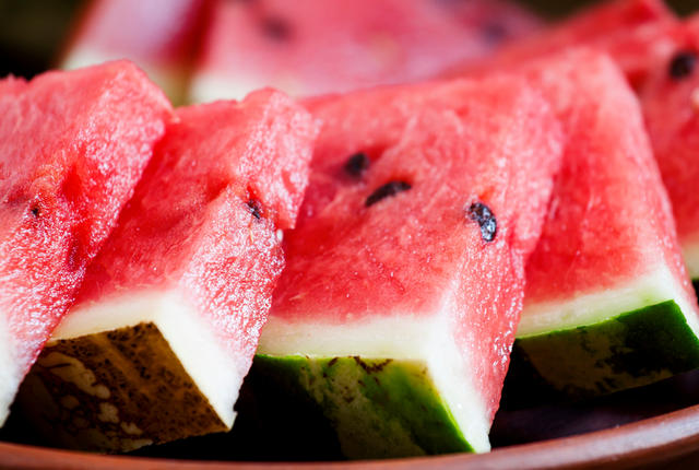 Watermelon slices on a clay plate, selective focus