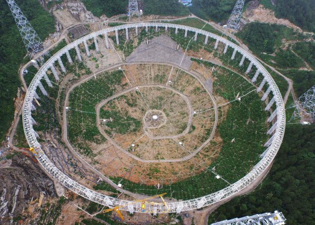 (FILES) This file photo taken on July 29, 2015 shows the five-hundred-metre Aperture Spherical Radio Telescope (FAST) under construction in Pingtang, southwestern China's Guizhou province.  The world's largest radio telescope began operating in southwestern China on September 25, 2016, a project which Beijing says will help humanity search for alien life.   / AFP PHOTO / STR /  - China OUTSTR/AFP/Getty Images
