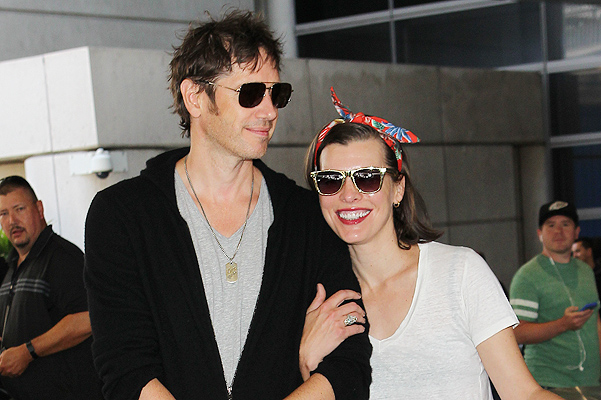 Milla Jovovich and Paul W. S. Anderson at Los Angeles International Airport (LAX) Featuring: Paul W. S. Anderson,Milla Jovovich Where: Los Angeles, California, United States When: 28 May 2014 Credit: WENN.com