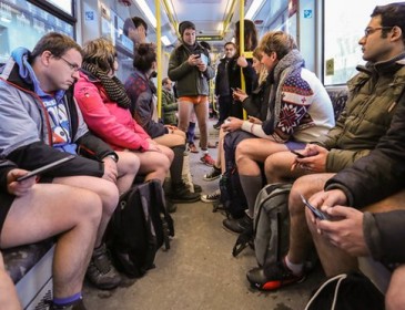Travellers cast off inhibitions on no pants subway ride day – in pictures