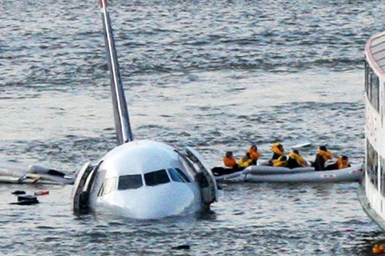 Passengers in an inflatable raft move away from an Airbus 320 US Airways aircraft that has gone down in the Hudson River in New York, Thursday Jan. 15, 2009. It was not immediately clear if there were injuries. (AP Photo/Bebeto Matthews)