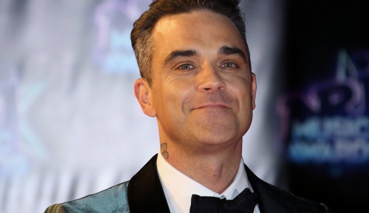 Robbie Williams management accused of selling gig tickets on resale sites for £65 more