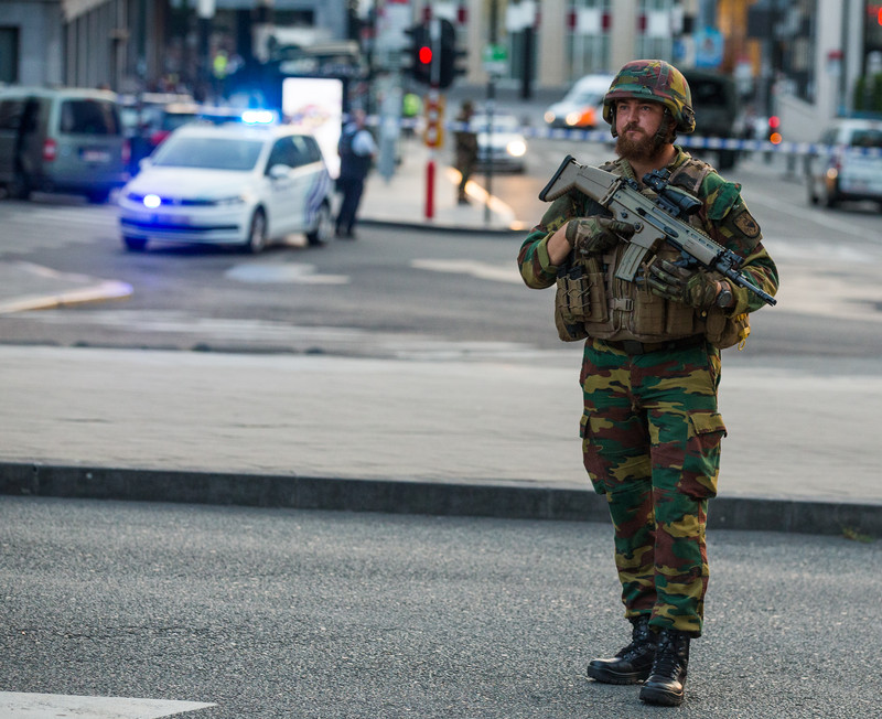 epa06039849 An armed soldier stands guard as police activies goes on outside of the Brussels Central Station after a neutralized terrorist attack attempt, in Brussels, Belgium, 20 June 2017. According to Belgian media, police shot a suspect wearing an explosive belt at the Brussels Central Station. Belgian police also confirmed there was a small explosion in the Brussels Central Station, but said there are not much damage done and situation is under control. The cause of the explosion is unknown.  EPA/STEPHANIE LECOCQ
